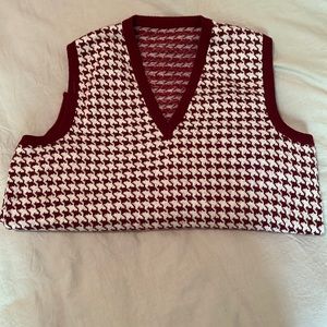 Houndstooth maroon sweater vest.